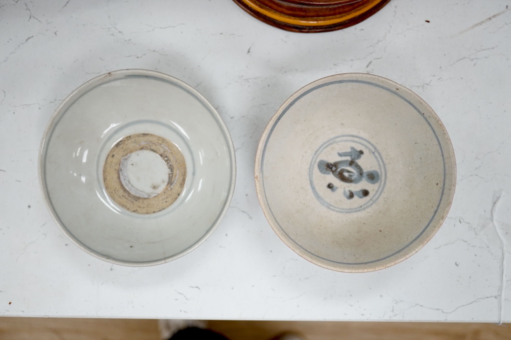 A Chinese blue and white plate, a tea bowl, two pottery bowls and a wooden stand (5). Condition - fair to good.